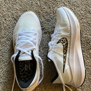 Brand new. Nike zoom Winflo air zoom, US size 8. With a leopard inside the soul.